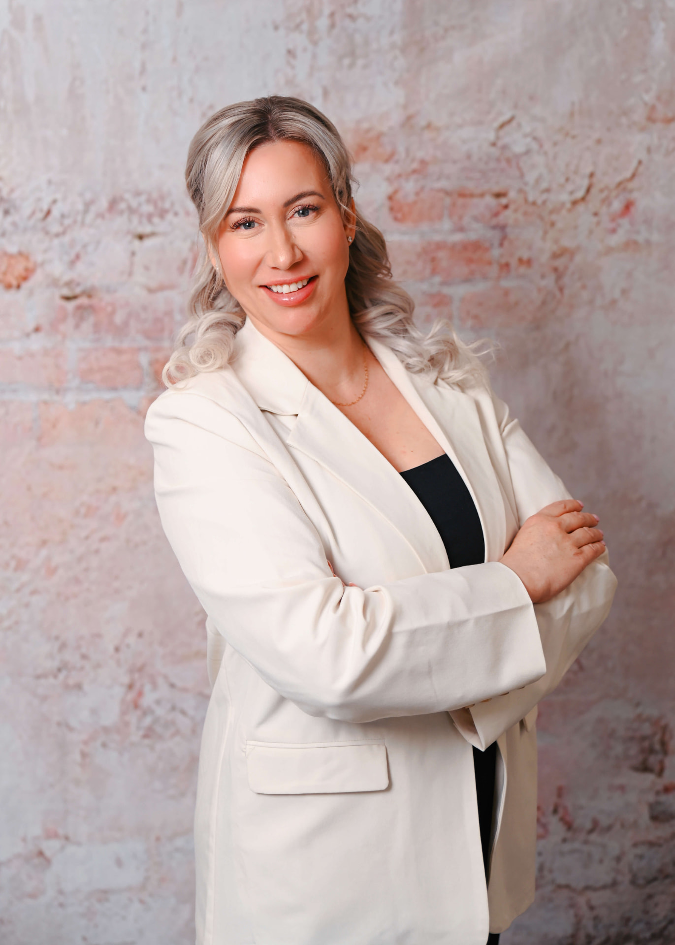 Danielle M. Pierce, Esq., portrait against a brick wall